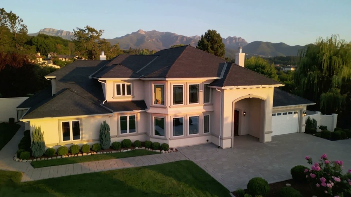 Two-storey home with an asphalt shingle roof