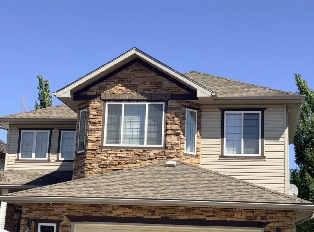 Asphalt shingles showing granule loss on a Calgary roof