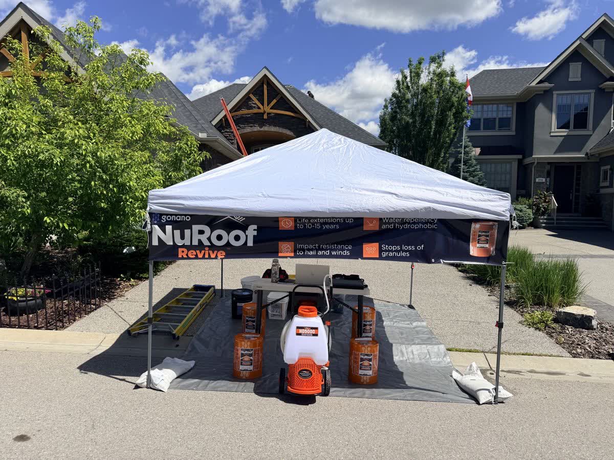 GoNano NuRoof branded tent and spray equipment at a Nano Shield job site in Calgary